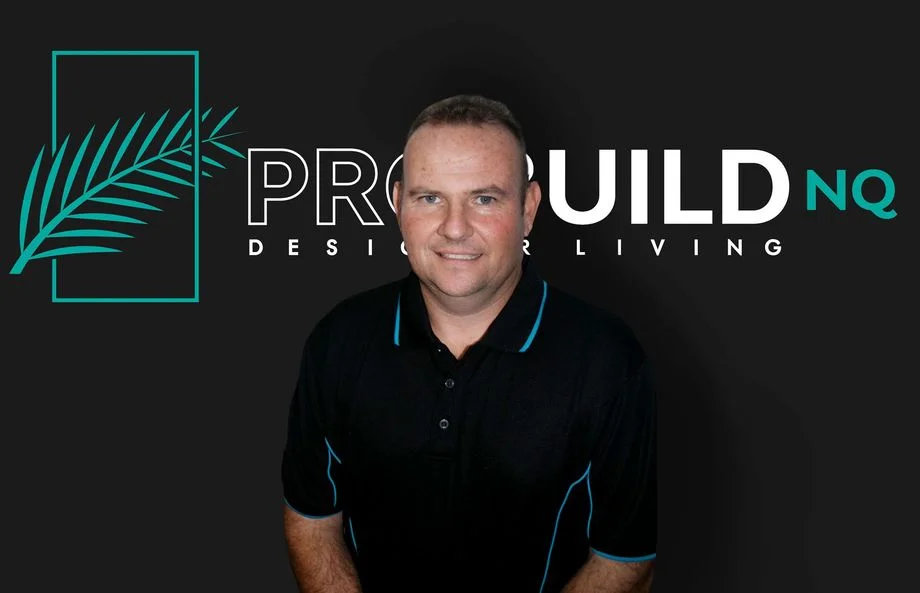 John Pritchard in front of ProBuild NQ branding